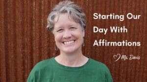 Smiling Ms Davis with short silver hair in front of a rust-colored fence. Text reads: "Starting Our Day With Affirmations, Love Ms. Davis."