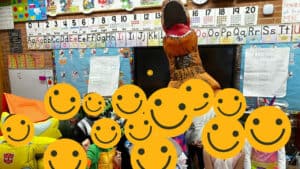 Ms Davis as a T-Rex Dinosaur with her students, their faces hidden behind smiling emojis.